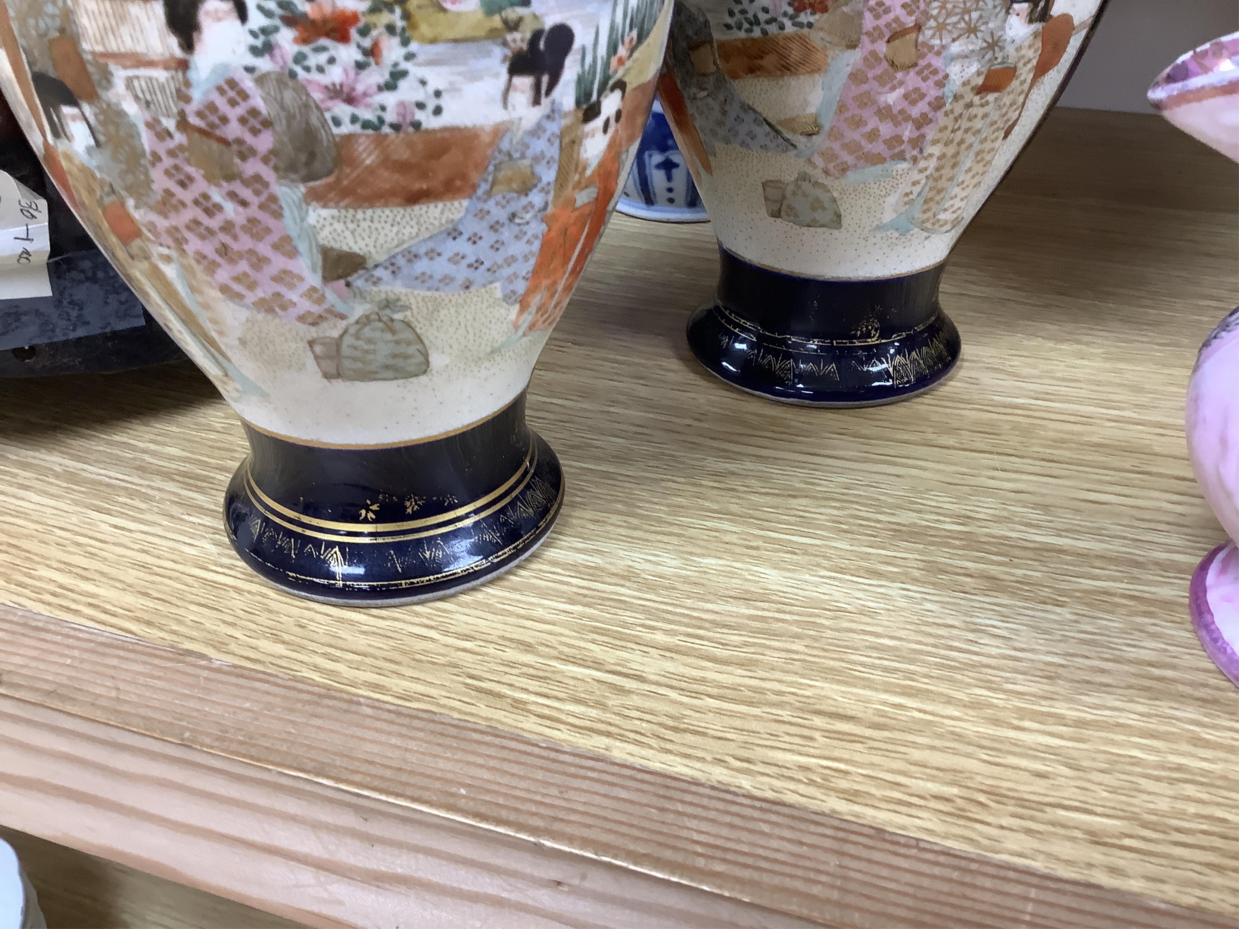 A late 19th century Chinese blue and white vase and cover and two Japanese Satsuma pottery vases, largest 24cm high